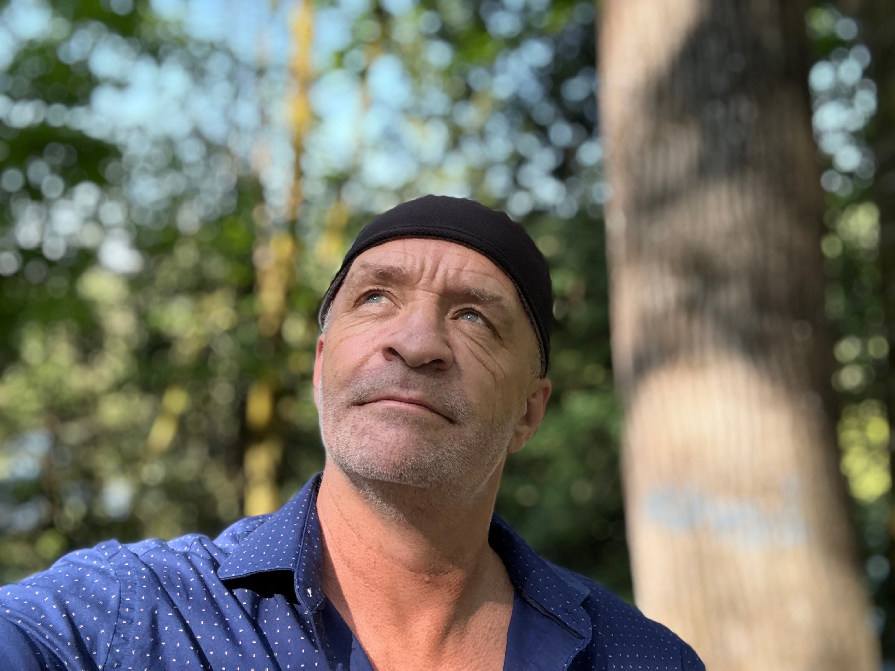 Ray outdoors beneath the trees